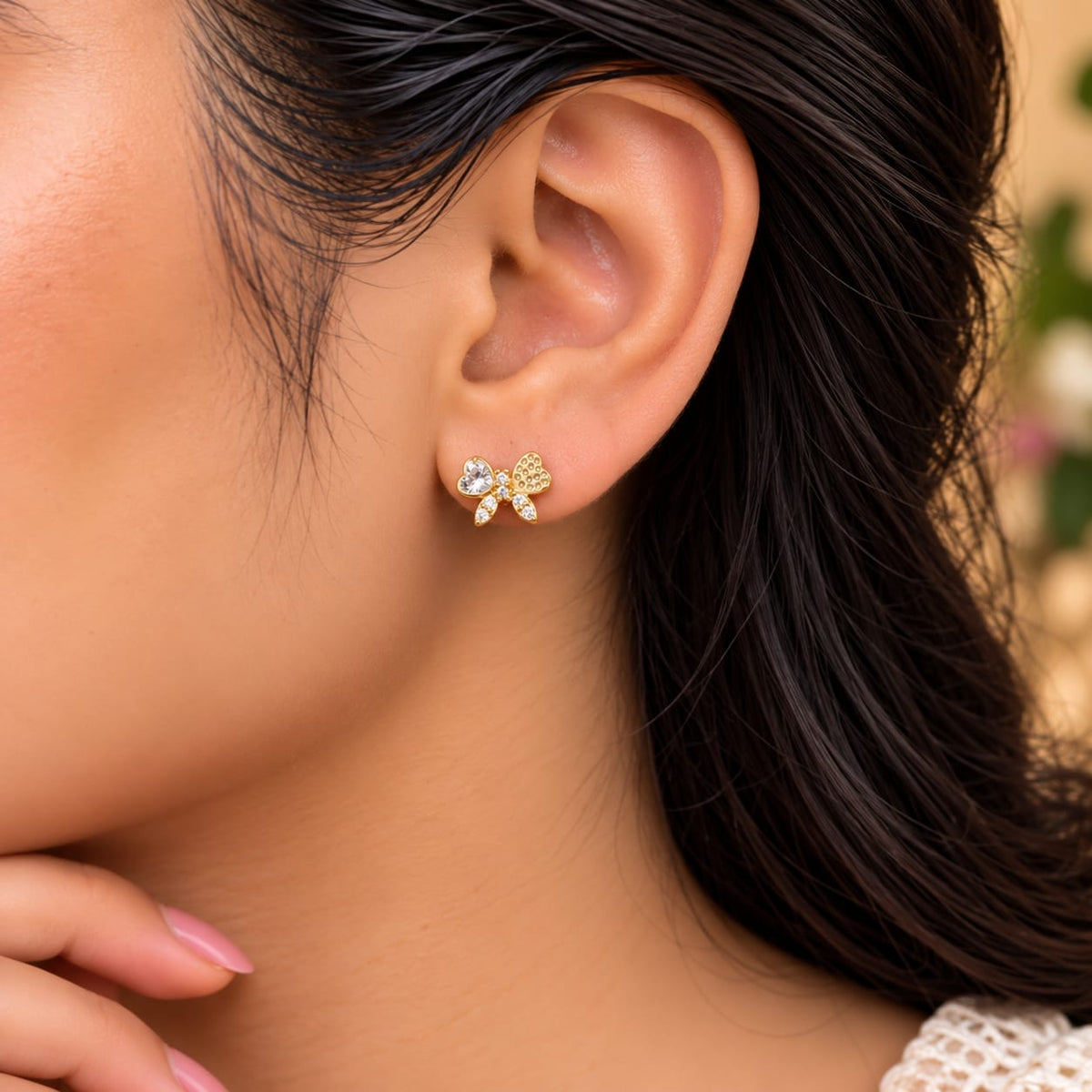 Aura Butterfly Bow Pavé Crystal Stud Earrings - On-Ear Styling View - SURIYAS Jewel Studio